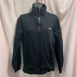 Lacoste size small black sweater with brand name writer on collar